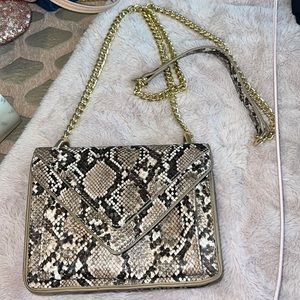 Snake print crossbody bag with gold chain